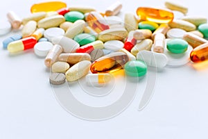 Vitamins, omega 3, cod-liver oil, dietary supplement and tablets an embankment on a light background