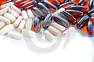 Vitamins, omega 3, cod-liver oil, dietary supplement and tablets an embankment on a light background close up