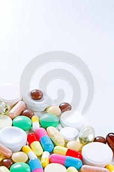 Vitamins, omega 3, cod-liver oil, dietary supplement and tablets an embankment on a light background