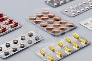 Vitamins and pills blister packs, close-up