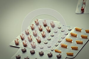 Vitamins and pills blister packs, close-up