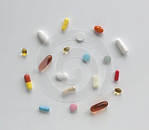 Vitamins, supplement and tablets on a white background