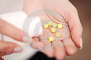 Vitamins And Supplements. Closeup Of Woman Hands Holding Variety Of Colorful Vitamin Pills. Close-up Handful Of Medication, Medici