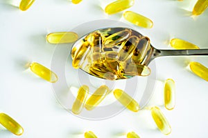 Vitamins supplements, fish oil in yellow capsules omega 3.