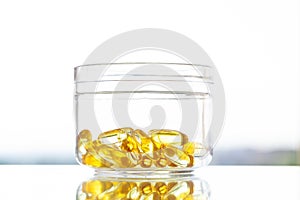 Vitamins supplements, fish oil in yellow capsules omega 3.