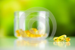 Vitamins supplements, fish oil in yellow capsules omega 3.