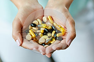 Vitamins And Supplements. Woman Hands Full Of Medication Pills