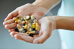 Vitamins And Supplements. Woman Hands Full Of Medication Pills