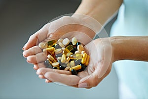 Vitamins And Supplements. Woman Hands Full Of Medication Pills photo