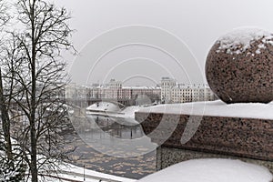 Vitebsk, Belarus, January 5, 2024. Bridge over the river and granite ball of the fence.