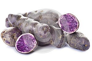 Vitelotte or blue-violet potatoes photo