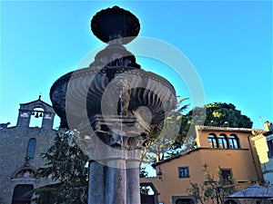 Viterbo city fountain and ancient buildings, Italy. Art and the sky