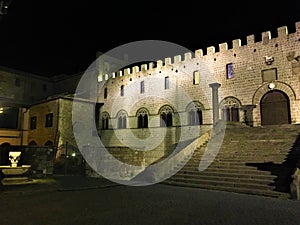 Viterbo, medieval ancient city near Rome, Italy. Papal Palace, square, staircase, night, shadows and light