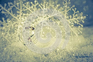 vitreous angel and simple white snowflake decoration photo