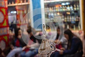 Vitrine of botlle glass store with camel in detail photo