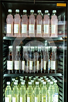 Vitrine with a variety of soft drinks in capped glass bottles