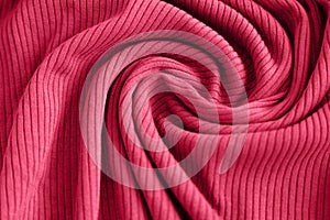 Viva magenta color of the year 2023, ribbed texture of cloth. Fabric textile pattern.