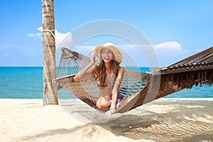 Vivacious beautiful woman in hammock