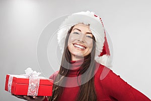 Vivacious happy woman with a Christmas gift