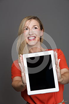 Vivacious joyful woman with a tablet computer