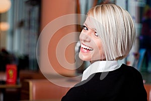 Vivacious laughing woman in a restaurant