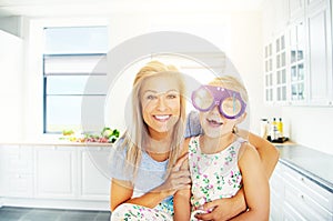 Vivacious little girl in outsized plastic glasses