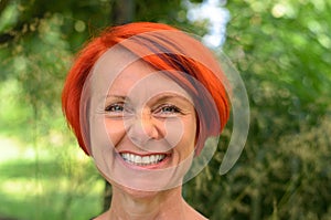 Vivacious middle-aged redhead woman