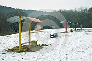 Vivid benches on a winter beach. serenity and emptiness.