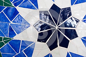 Vivid blue kaleidoscope background. Painted geometric pattern.