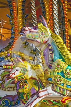 Vivid Carousel horses at fairground.