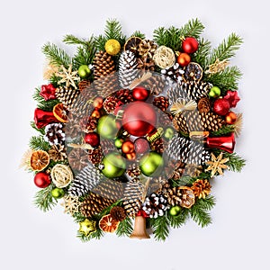 Vivid christmas wreath with fir branches, pine cones and rustic ornaments