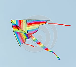 Vivid colored kite in the blue sky