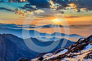 Himalaya golden orange sunrise over blue mountains at Laurebina La pass, Himalayas, Langtang, Nepal