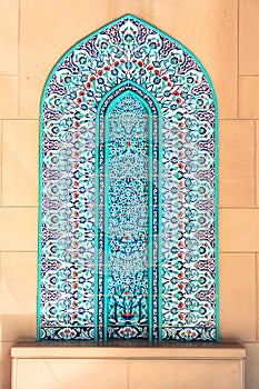 Vivid coloured turquoise mosaic on The Sultan Qaboos Grand Mosque wall