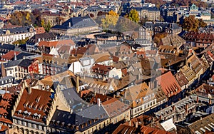 Vivid medieval house roofs covered traditional red and orange tiles in Strasbourg city