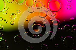 Vivid neon background with bubbles. Colorful abstract backdrop with bright gradients on blobs. Multicolor overflowing