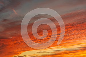 Vivid orange red sunset with dense cloud cover