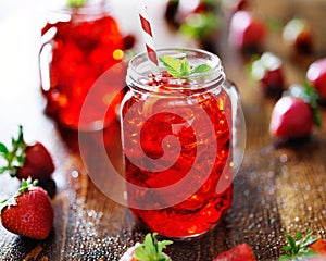 Vivid red strawberry cocktail in a jar