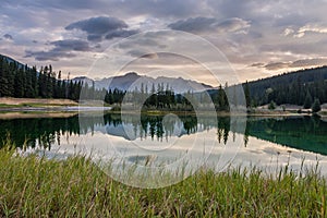 A vivid sunrise over Cascade Ponds