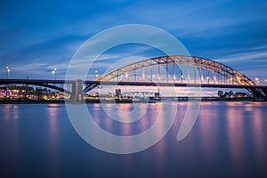 Vivid sunset at the Waalbrug Bridge in the Netherlands