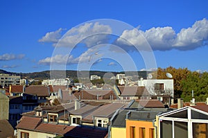 Vivid view over the town roofs and bright sky