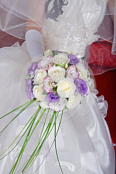 Vivid wedding bouquet at bride's hands