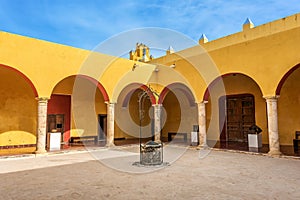 Vivid yellow colonnade under blue skies in Mexico