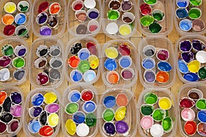 Vividly Colored Acrylic or Tempera Paints in Cups, Overhead View
