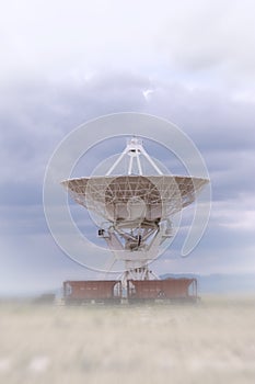 A VLA dish next to railcars