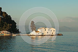 Vlacherna Monastery in Corfu island near Kanoni hill during a sunset