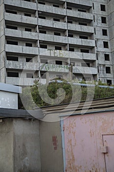 VLADIVOSTOK, RUSSIA - 03/09/2021 a soviet empty abandoned unfinished haunted residential concrete panel house building