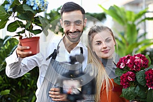 Vlogger Gardener Showing Camera Hortensia Flower