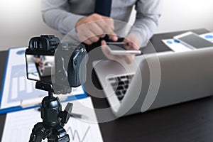 vlogger using laptop sharing her content making recording vide