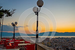 VLORA, ALBANIA: View of the cafe on the Kuzum Baba hill at sunset in Vlora.